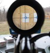 View through a scope of the reticle a bit off target